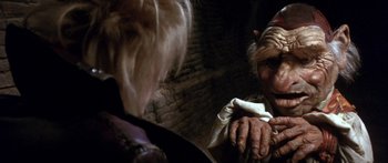 Movie still from “Labyrinth” (1986), directed by Jim Henson – A man and a woman are holding their hands together; Close Up shot, Over the shoulder angle