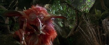 Movie still from “Labyrinth” (1986), directed by Jim Henson – The face of a red creature; Close Up shot, Low angle