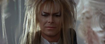 Movie still from “Labyrinth” (1986), directed by Jim Henson – Jareth the goblin king from the movie labyrinth; Close Up shot, Overhead angle
