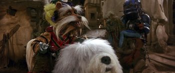 Movie still from “Labyrinth” (1986), directed by Jim Henson – A dog is standing next to another dog in costume; Close Up shot, Low angle