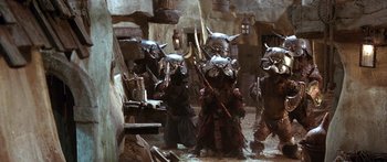 Movie still from “Labyrinth” (1986), directed by Jim Henson – A group of people dressed in costumes and masks; Wide shot, High angle
