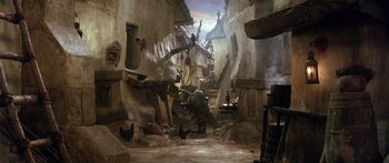 Movie still from “Labyrinth” (1986), directed by Jim Henson – An image of an animated scene with chickens in the background; Wide shot, High angle