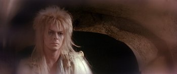 Movie still from “Labyrinth” (1986), directed by Jim Henson – Jareth the goblin king from labyrinth; Close Up shot, Over the shoulder angle