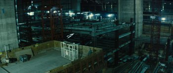 Movie still from “Locke” (2013), directed by Steven Knight – A building with a lot of lights in it; Extreme Wide shot, High angle