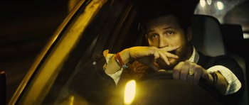 Movie still from “Locke” (2013), directed by Steven Knight – A man sitting in the driver's seat of a car; Close Up shot, Low angle
