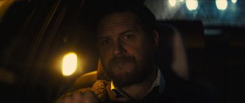 Movie still from “Locke” (2013), directed by Steven Knight – A person sitting in a car; Close Up shot, Over the shoulder angle