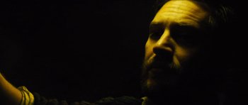 Movie still from “Locke” (2013), directed by Steven Knight – A man with a goatee and a beard; Close Up shot, Low angle