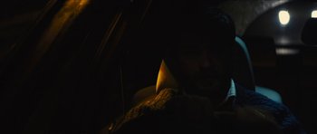 Movie still from “Locke” (2013), directed by Steven Knight – A man sitting in a car in the middle of the night; Close Up shot, High angle
