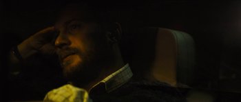 Movie still from “Locke” (2013), directed by Steven Knight – A person wearing a jacket; Close Up shot, High angle