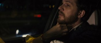 Movie still from “Locke” (2013), directed by Steven Knight – A person in a car; Close Up shot, Over the shoulder angle