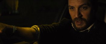 Movie still from “Locke” (2013), directed by Steven Knight – A person in a car in the dark; Close Up shot, Over the shoulder angle