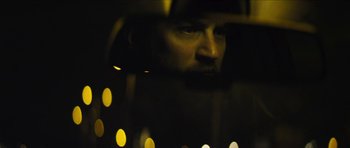 Movie still from “Locke” (2013), directed by Steven Knight – A man looking into a car's rear view mirror; Extreme Close Up shot, Low angle