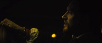 Movie still from “Locke” (2013), directed by Steven Knight – A person holding a glove; Close Up shot, Low angle