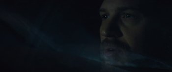 Movie still from “Locke” (2013), directed by Steven Knight – A man with a beard is looking at the camera; Extreme Close Up shot, Over the shoulder angle