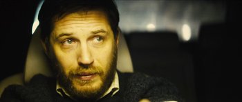 Movie still from “Locke” (2013), directed by Steven Knight – A person with a beard; Close Up shot, Over the shoulder angle