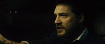 Movie still from “Locke” (2013), directed by Steven Knight – A person with a beard; Close Up shot, High angle