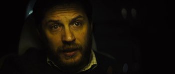 Movie still from “Locke” (2013), directed by Steven Knight – A man's face in the dark; Close Up shot, Over the shoulder angle