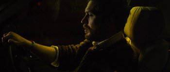 Movie still from “Locke” (2013), directed by Steven Knight – A person wearing a sweater; Close Up shot, High angle