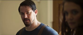 Movie still from “Logan Lucky” (2017), directed by Steven Soderbergh – A person with a beard; Close Up shot, Over the shoulder angle