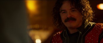 Movie still from “Logan Lucky” (2017), directed by Steven Soderbergh – A person with a mustache; Close Up shot, Over the shoulder angle