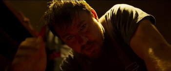 Movie still from “Logan Lucky” (2017), directed by Steven Soderbergh – A person with a beard; Close Up shot, Low angle