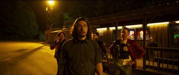 Movie still from “Logan Lucky” (2017), directed by Steven Soderbergh – A group of men standing on the side of a road; Medium shot, Low angle