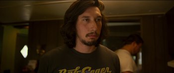 Movie still from “Logan Lucky” (2017), directed by Steven Soderbergh – A person with long brown hair; Close Up shot, Over the shoulder angle