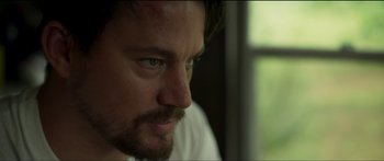 Movie still from “Logan Lucky” (2017), directed by Steven Soderbergh – A man's face in a white shirt; Close Up shot, Low angle