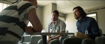 Movie still from “Logan Lucky” (2017), directed by Steven Soderbergh – A group of people sitting around a table; Medium shot, Over the shoulder angle