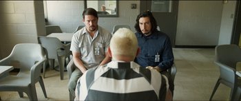 Movie still from “Logan Lucky” (2017), directed by Steven Soderbergh – A group of men sitting next to each other in a room; Medium shot, Over the shoulder angle
