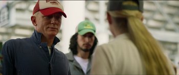 Movie still from “Logan Lucky” (2017), directed by Steven Soderbergh – A group of men standing next to each other; Close Up shot, Over the shoulder angle