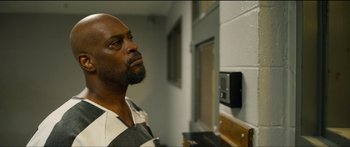 Movie still from “Logan Lucky” (2017), directed by Steven Soderbergh – A man in a jail cell looking into a mirror; Close Up shot, Low angle