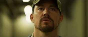 Movie still from “Logan Lucky” (2017), directed by Steven Soderbergh – A person wearing a hat; Close Up shot, Low angle