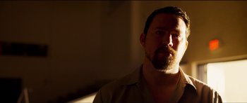 Movie still from “Logan Lucky” (2017), directed by Steven Soderbergh – A man with a goatee and a beard; Close Up shot, Low angle