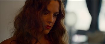 Movie still from “Logan Lucky” (2017), directed by Steven Soderbergh – A person with long brown hair; Close Up shot, Low angle