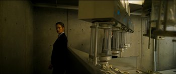 Movie still from “Logan Lucky” (2017), directed by Steven Soderbergh – A man in a suit standing in front of a counter; Medium shot, Low angle