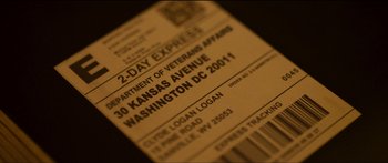 Movie still from “Logan Lucky” (2017), directed by Steven Soderbergh – Picture of a 2 - day express ticket; Extreme Close Up shot, High angle