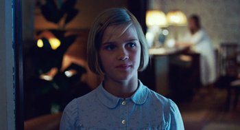 Movie still from “Lore” (2012), directed by Cate Shortland – A young woman with short blonde hair wearing a blue shirt; Close Up shot, Over the shoulder angle
