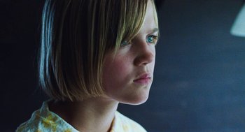 Movie still from “Lore” (2012), directed by Cate Shortland – A person with short blonde hair; Close Up shot, Low angle