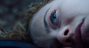 Movie still from “Lore” (2012), directed by Cate Shortland – A woman's face with blue eyes; Extreme Close Up shot, Overhead angle