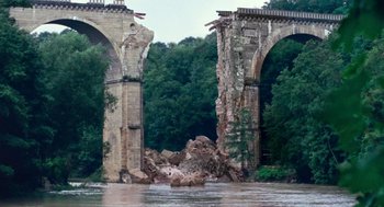 Movie still from “Lore” (2012), directed by Cate Shortland – A bridge that has been destroyed by a landslide; Extreme Wide shot, High angle