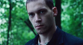 Movie still from “Lore” (2012), directed by Cate Shortland – A person wearing a black shirt; Close Up shot, Low angle