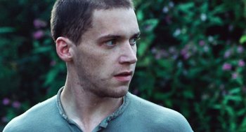 Movie still from “Lore” (2012), directed by Cate Shortland – A person looking at the camera; Close Up shot, Low angle