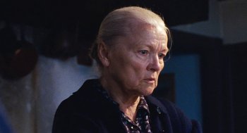 Movie still from “Lore” (2012), directed by Cate Shortland – An older woman with a serious look on her face; Close Up shot, Low angle