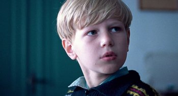 Movie still from “Lore” (2012), directed by Cate Shortland – A young boy looking at the camera; Close Up shot, Low angle
