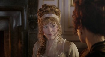 Movie still from “Love & Friendship” (2016), directed by Whit Stillman – A woman in a white dress with long blonde hair; Close Up shot, Over the shoulder angle