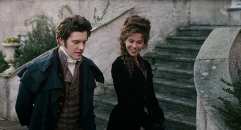 Movie still from “Love & Friendship” (2016), directed by Whit Stillman – A man and a woman walking down a set of stairs; Medium shot, Low angle