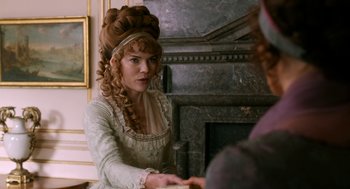 Movie still from “Love & Friendship” (2016), directed by Whit Stillman – A woman in a white dress with long blonde hair; Medium shot, Over the shoulder angle