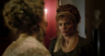 Movie still from “Love & Friendship” (2016), directed by Whit Stillman – A woman in a dress looking into a mirror; Close Up shot, Over the shoulder angle