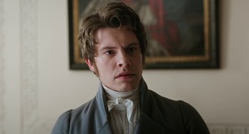 Movie still from “Love & Friendship” (2016), directed by Whit Stillman – A young man in a victorian era suit; Close Up shot, Over the shoulder angle